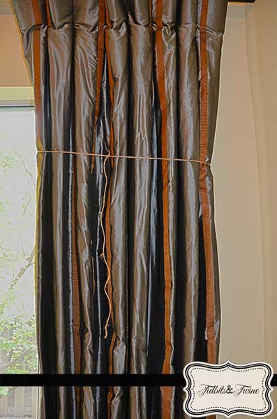 Curtains Loosely Tied with Twine to Train 