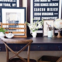 Desk with artwork leaning and layered on top