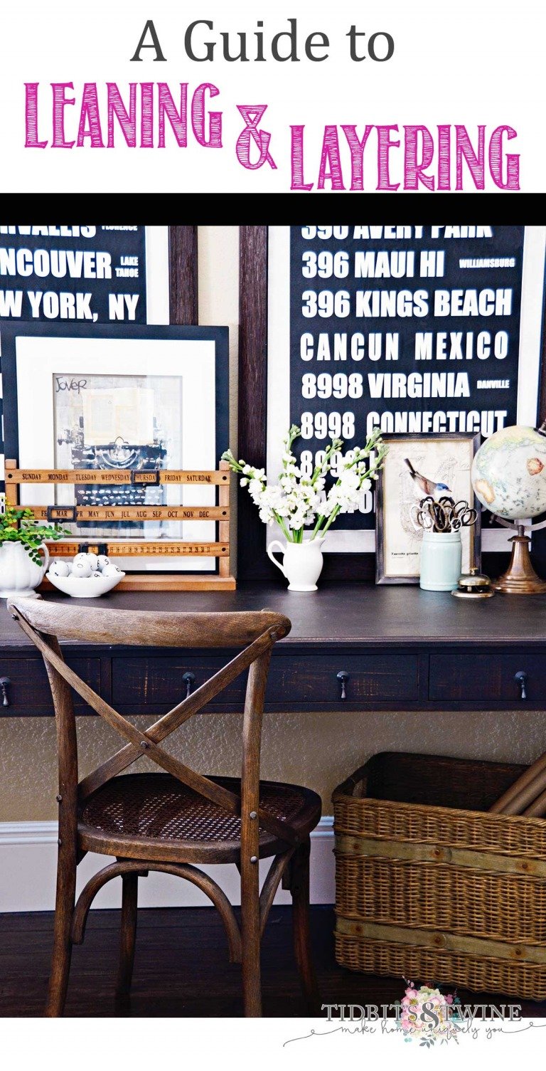 Desk with artwork leaning and layered on top