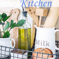 kitchen vignette with glass pitcher holding wooden utensils