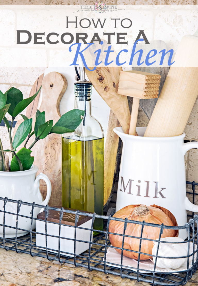 kitchen vignette with glass pitcher holding wooden utensils