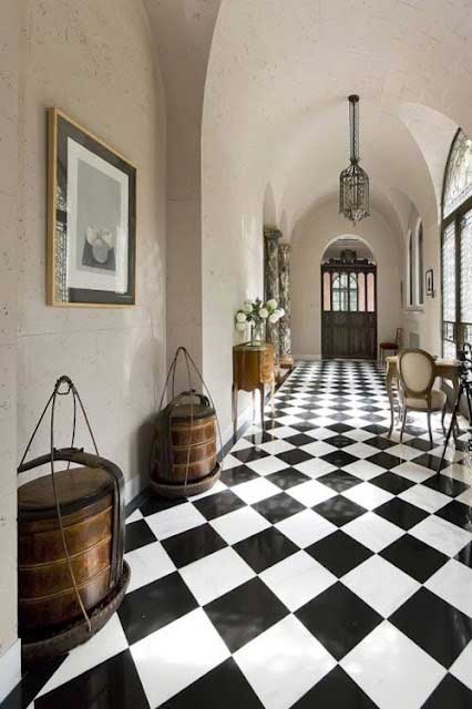 European foyer with black and white checkered tiles and white walls