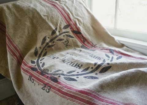 Closeup of vintage grain sack used as a throw blanket