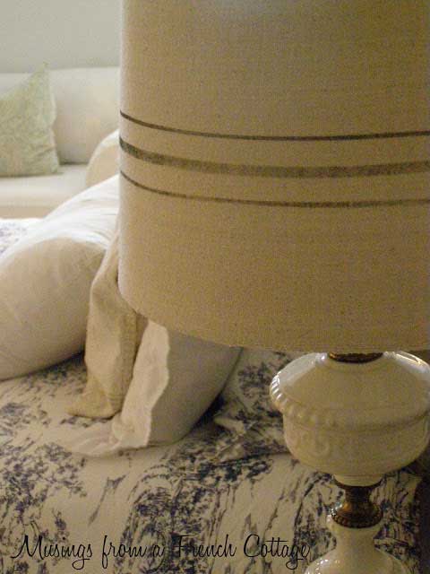 A closeup of a DIY French grain sack lamp shade.