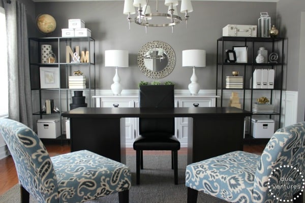 Gray home office with black furniture and blue accents chairs