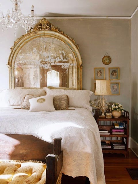 Oversized French mirrored headboard in bedroom