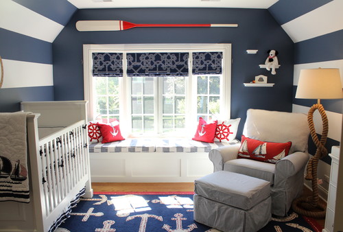 Nautical themed baby nursery in blue white and red with blue and white striped walls