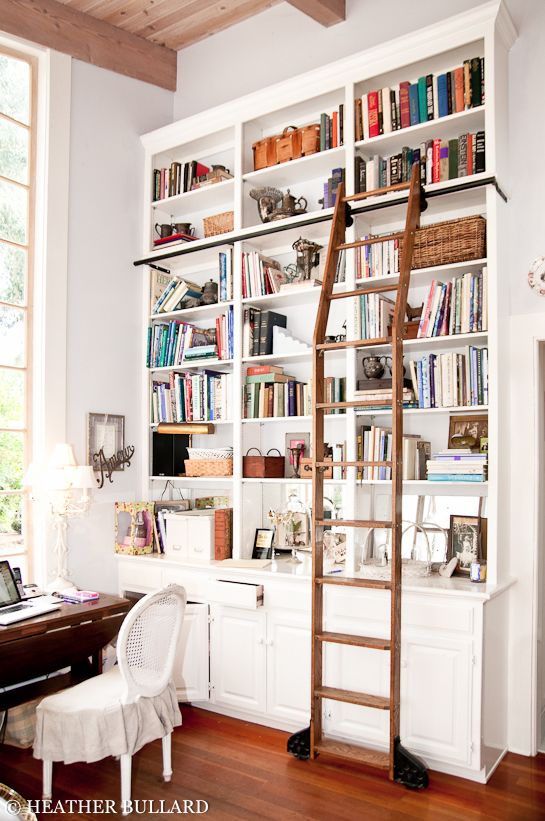 white library bookshelves with wood library ladder