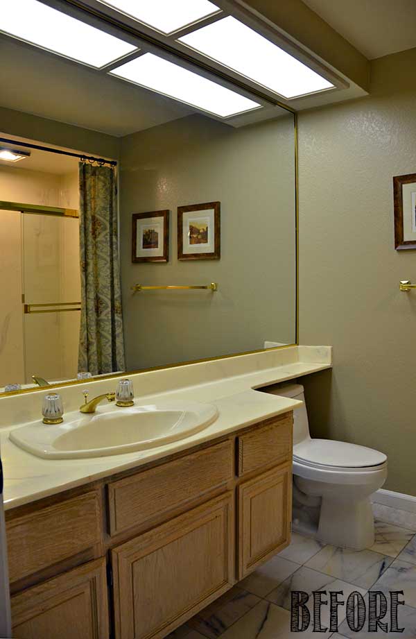 1980s bathroom with cultured marble countertop and gold fixtures - Before Makeover