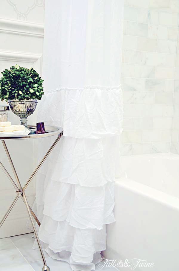 diy white ruffle shower curtain panel for tub shower combo with silver table next to it