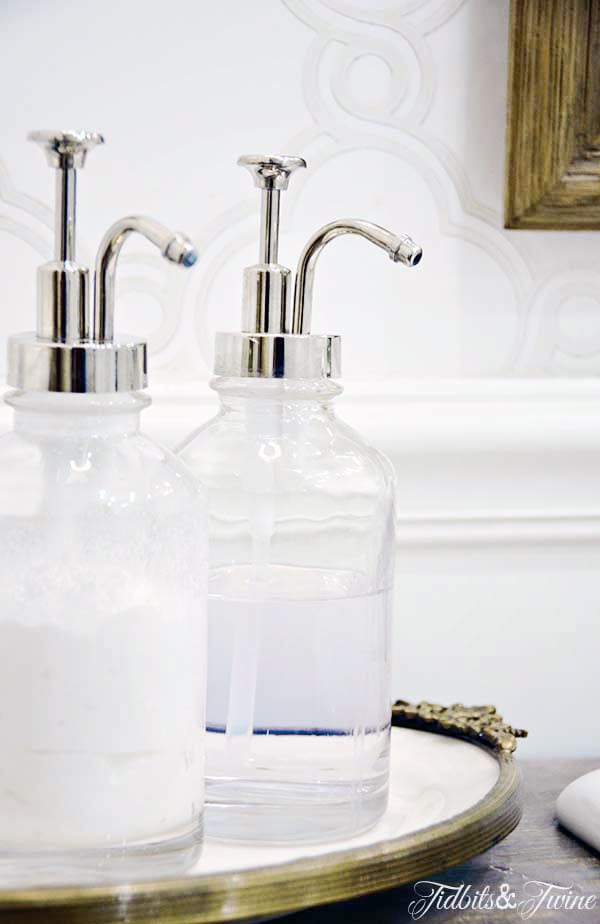 closeup of vintage inspired soap dispensers in a bathroom remodel