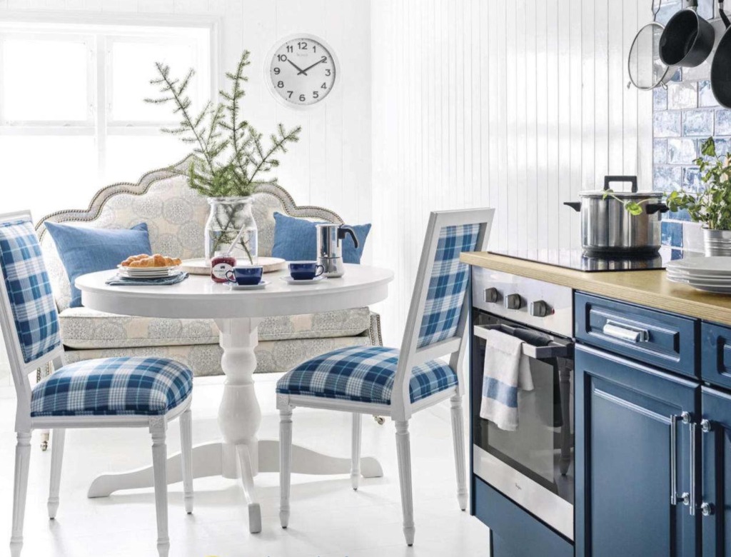 white and blue french kitchen eating area with settee and blue plaid chairs