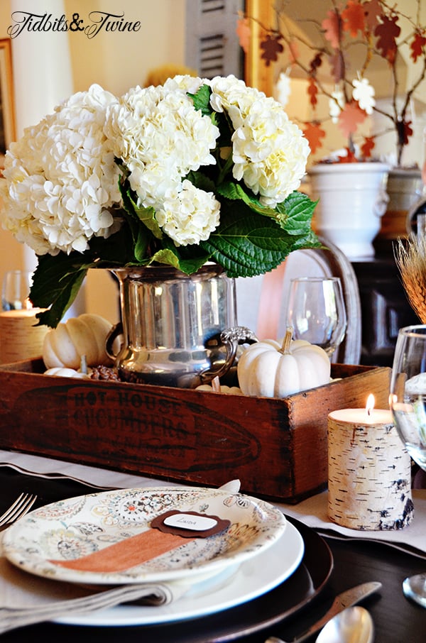 White Fall dining tablescape with candles and baby boo pumpkins