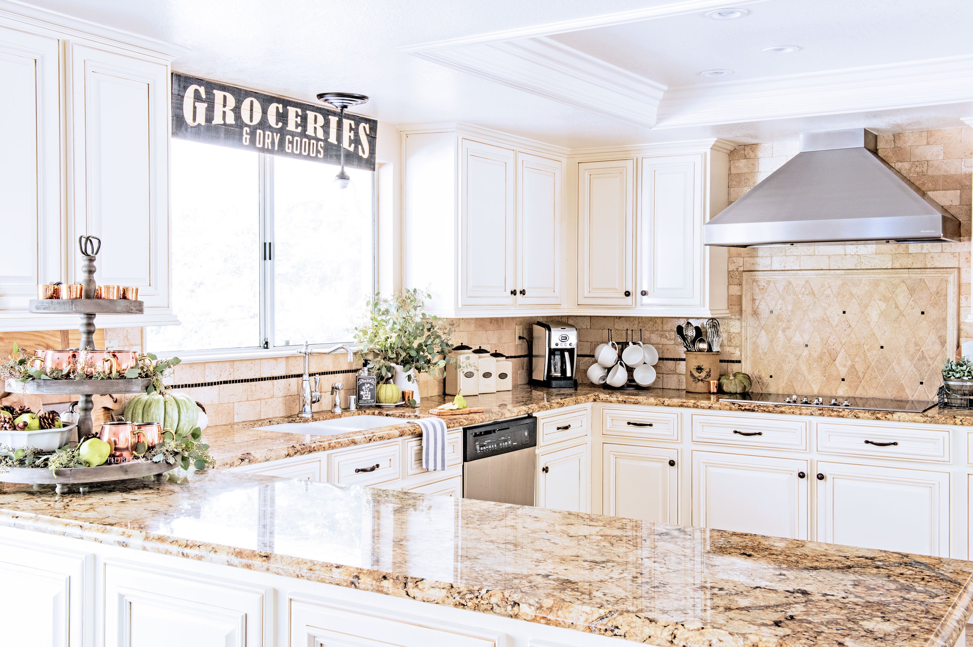 French farmhouse kitchen white cabinets and travertine tiles