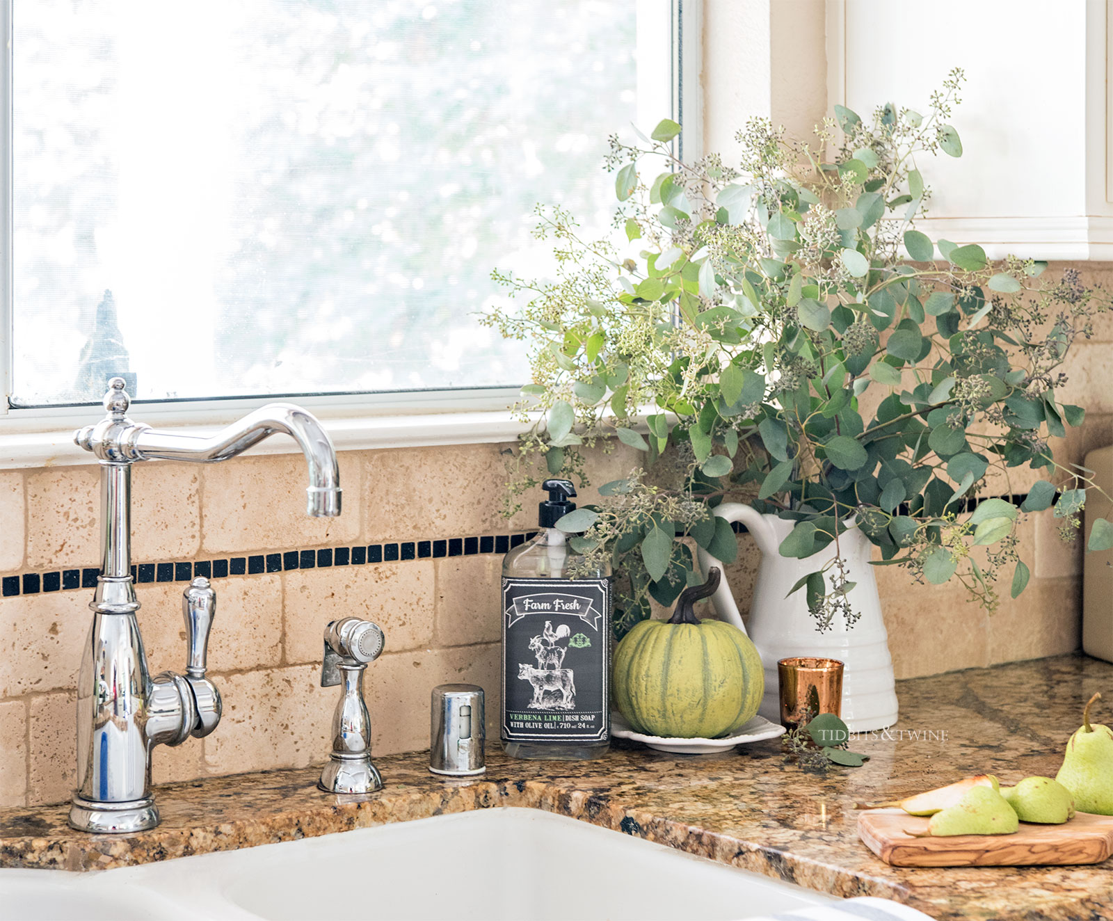 Farmhouse kitchen sink decorated for fall