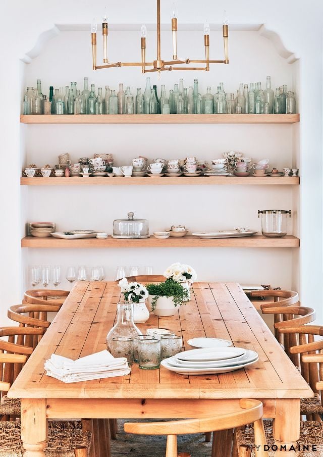 Opening kitchen shelving with bottle collection