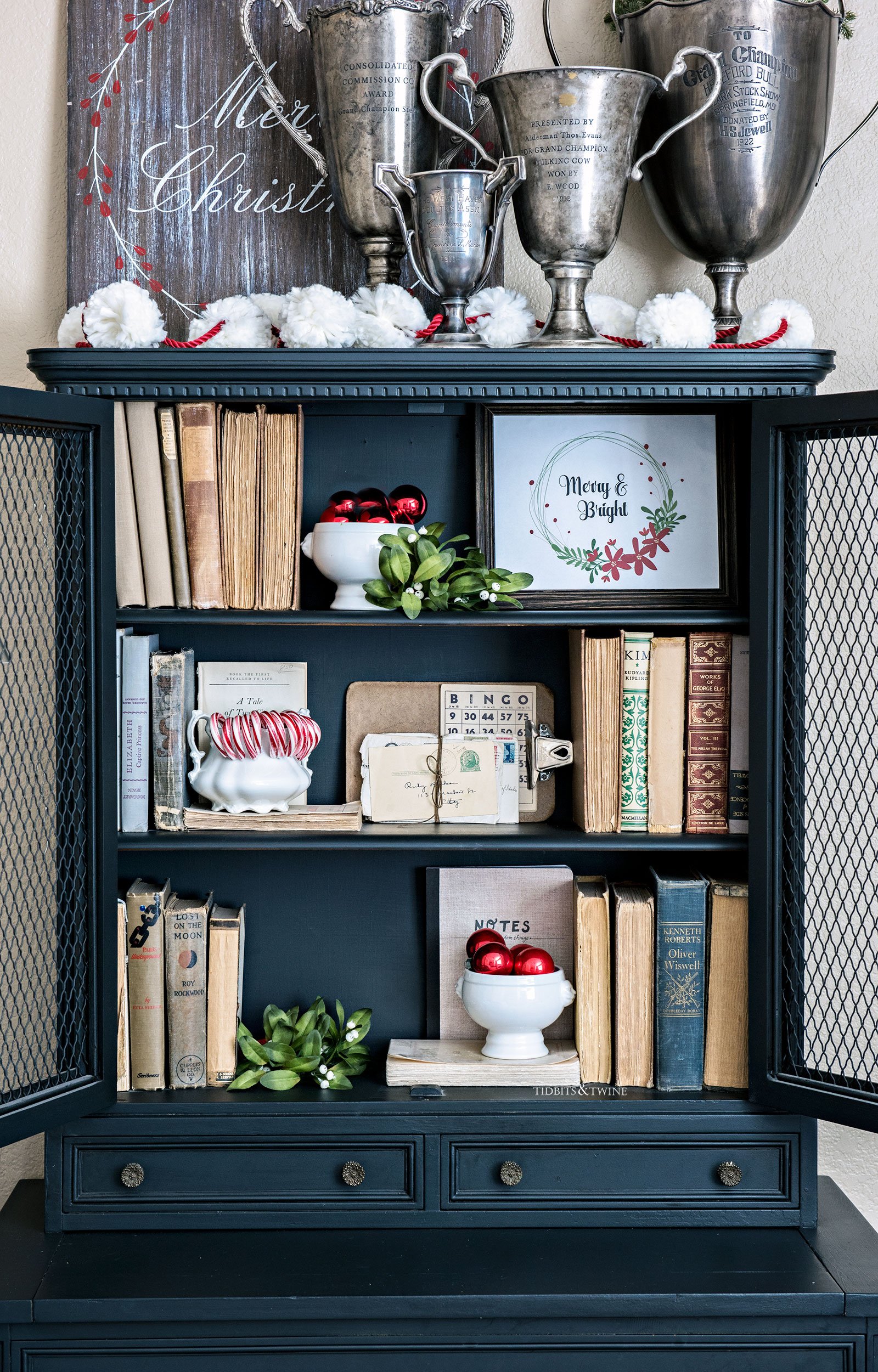 black cabinet shelves decorated for Christmas