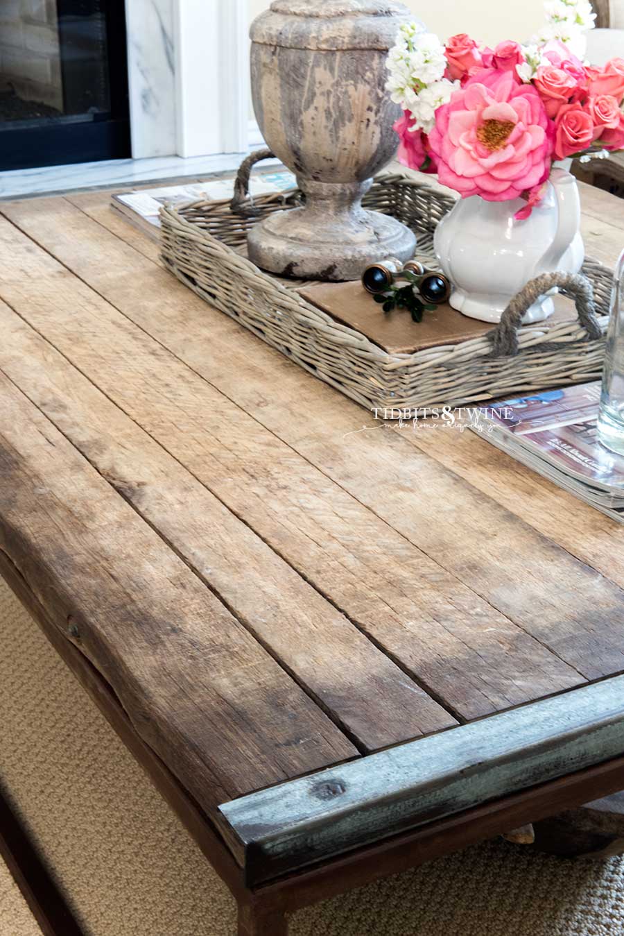 Industrial coffee table with basket centerpiece and pink roses