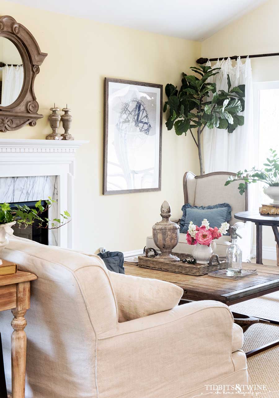 French wingback chairs and slipcovered sofa in living room