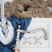 Elegant French marble master bathroom with blue, white and aged wood