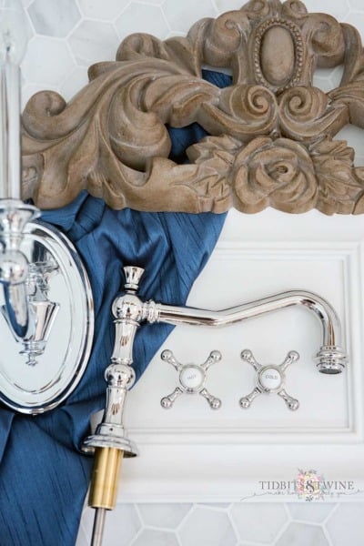 Elegant French marble master bathroom with blue, white and aged wood