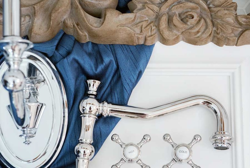 Elegant French marble master bathroom with blue, white and aged wood
