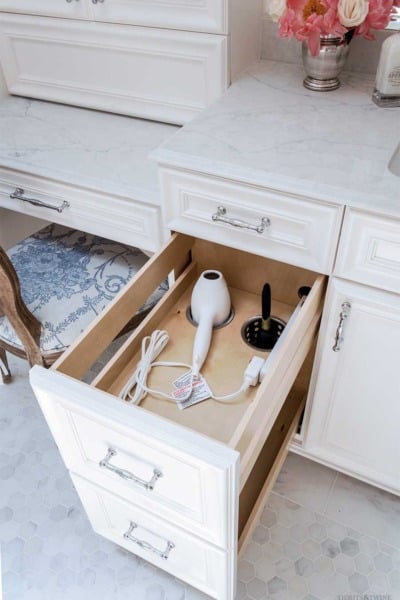 Bathroom vanity pullout hair dryer holder