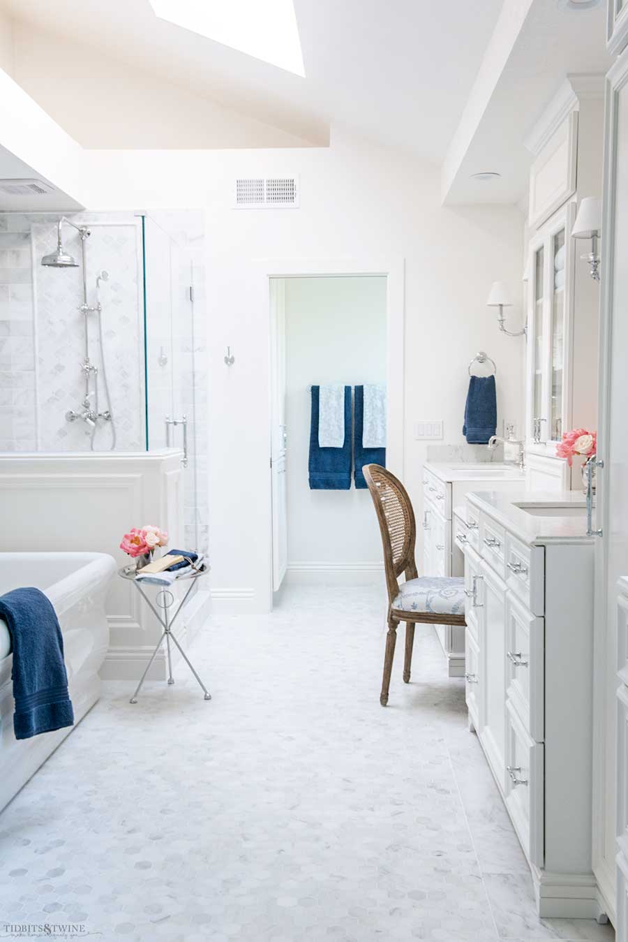 elegant marble bathroom with white hexagon marble floor white freestanding tub and shower pony wall