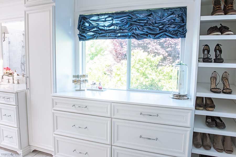 French elegant master bathroom with dressing area cabinets and shoe storage