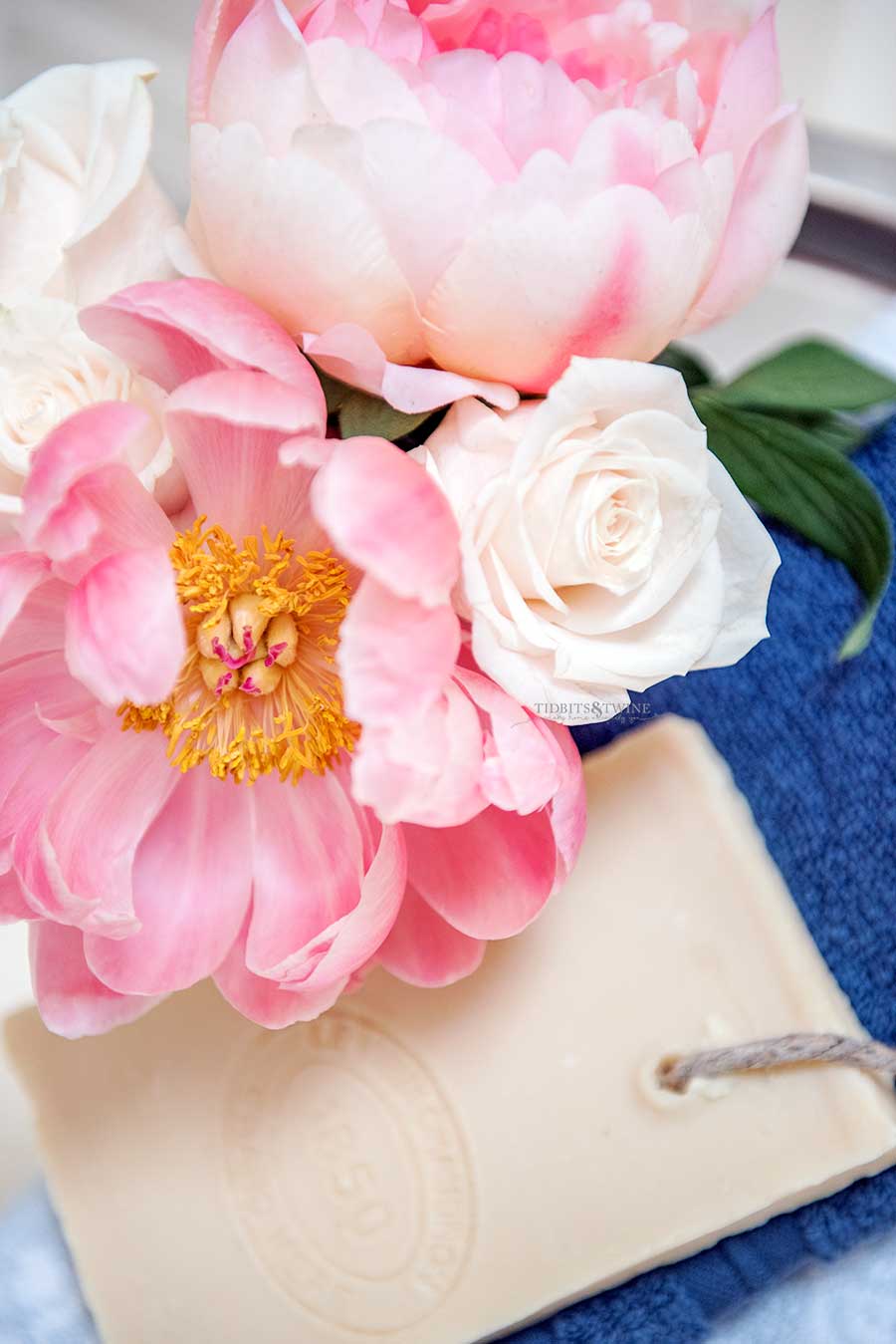 Pink peonies and white roses in a French elegant master bathroom