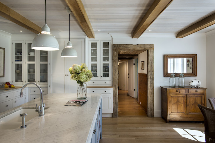 White kitchen with wood beams