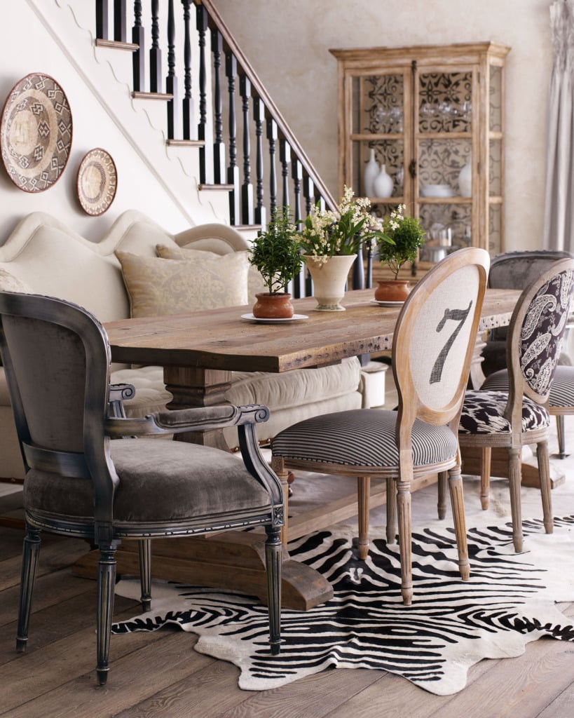 Mismatched dining chairs with trestle table and zebra rug