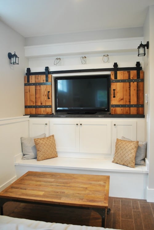 TV covered by sliding barn doors