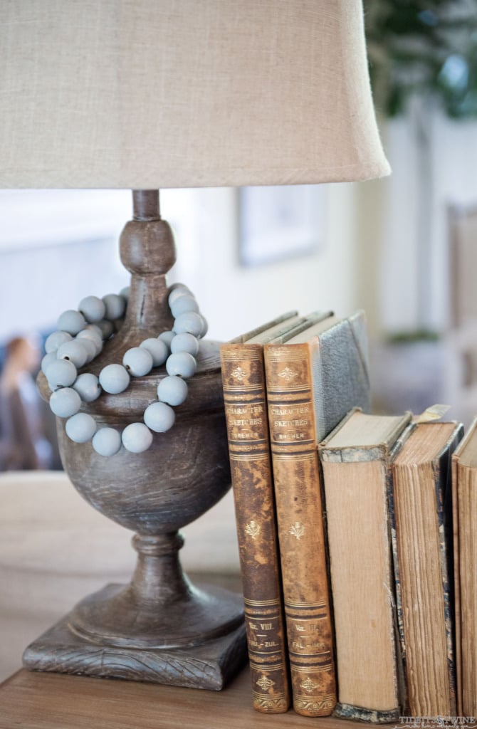 How to use chalk paint to create a faux aged wood look!  Paired with milk painted beads and deckled edge books