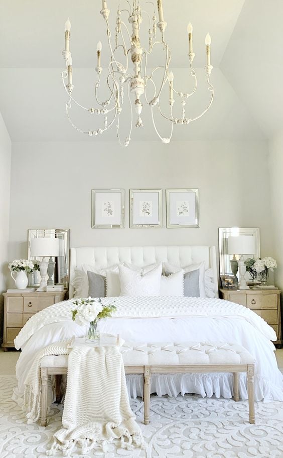 Master bedroom with white french chandelier