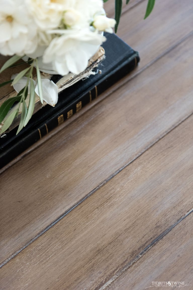 Closeup of French country coffee table top painted to look like wood