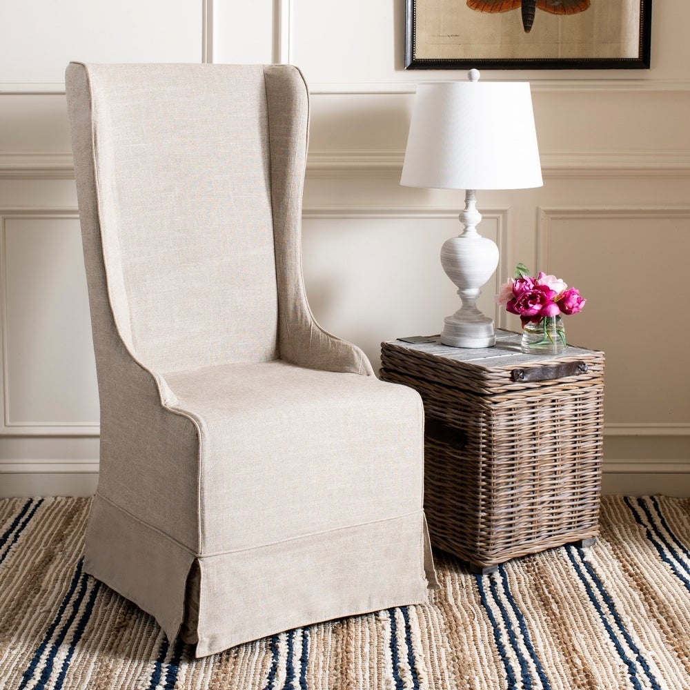 Beige wingback slipcovered dining chair from Joss & Main