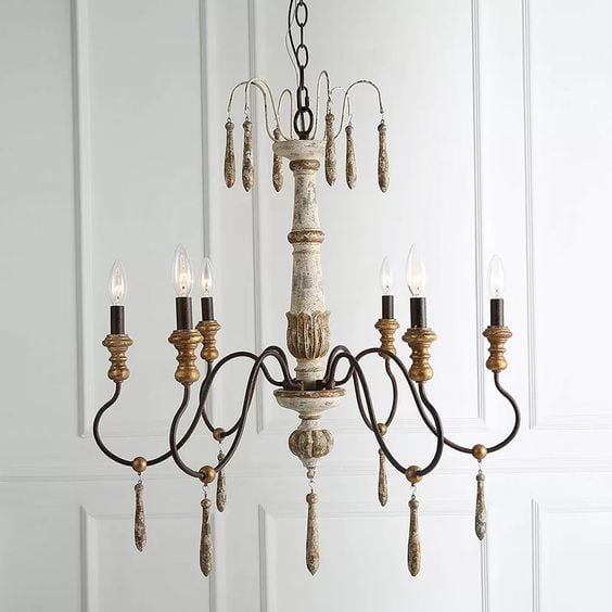 Closeup image of a French country chandelier with 6 lights and gold leafing