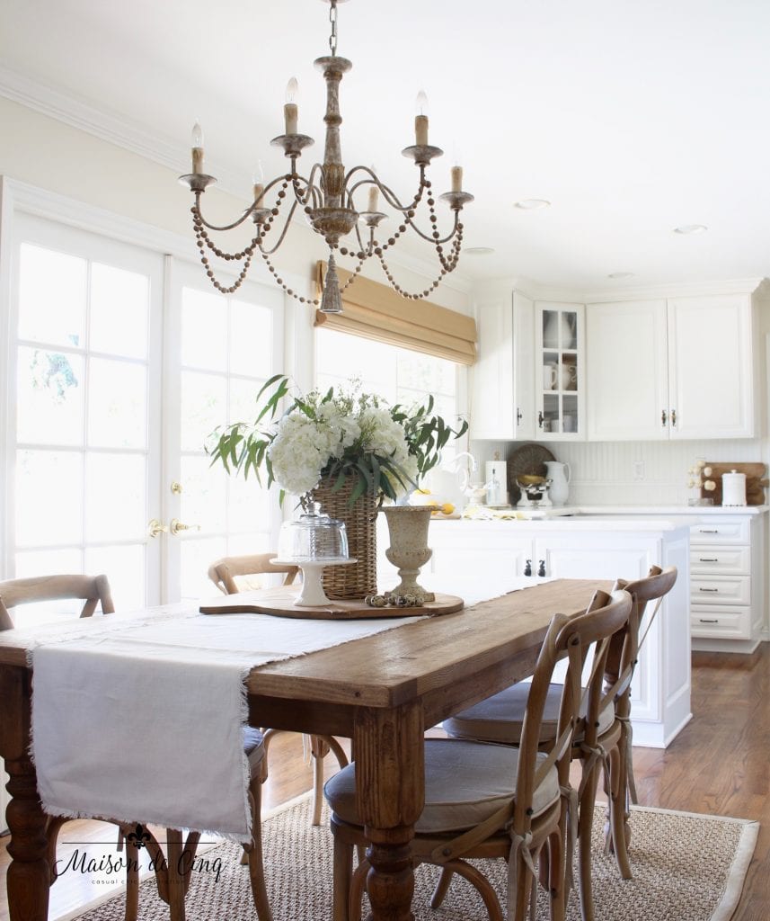 Beautiful French country chandelier with six candle drip lights and bead garland