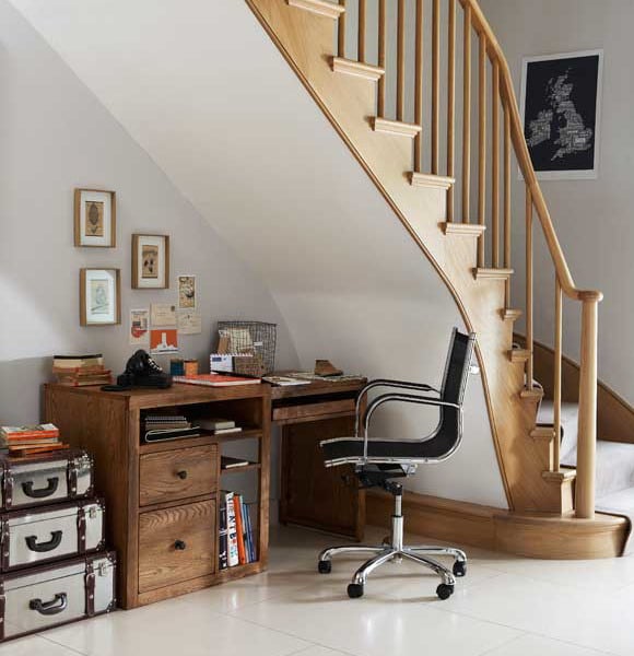 home office desk tucked underneath the stairs