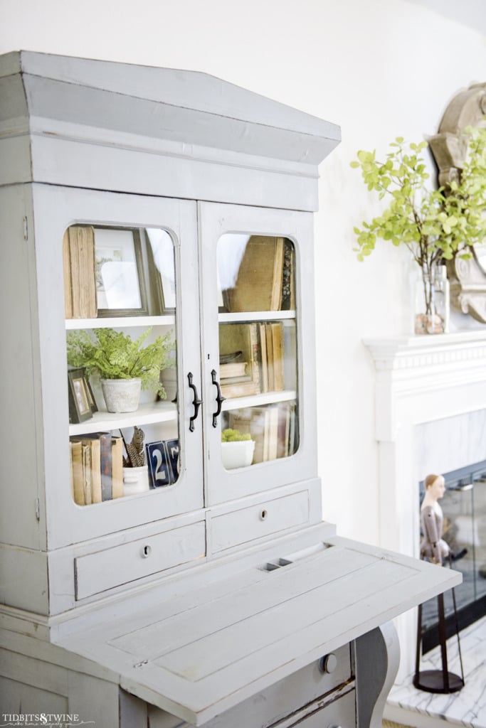 Blue french hutch with styled shelves with flip down desk