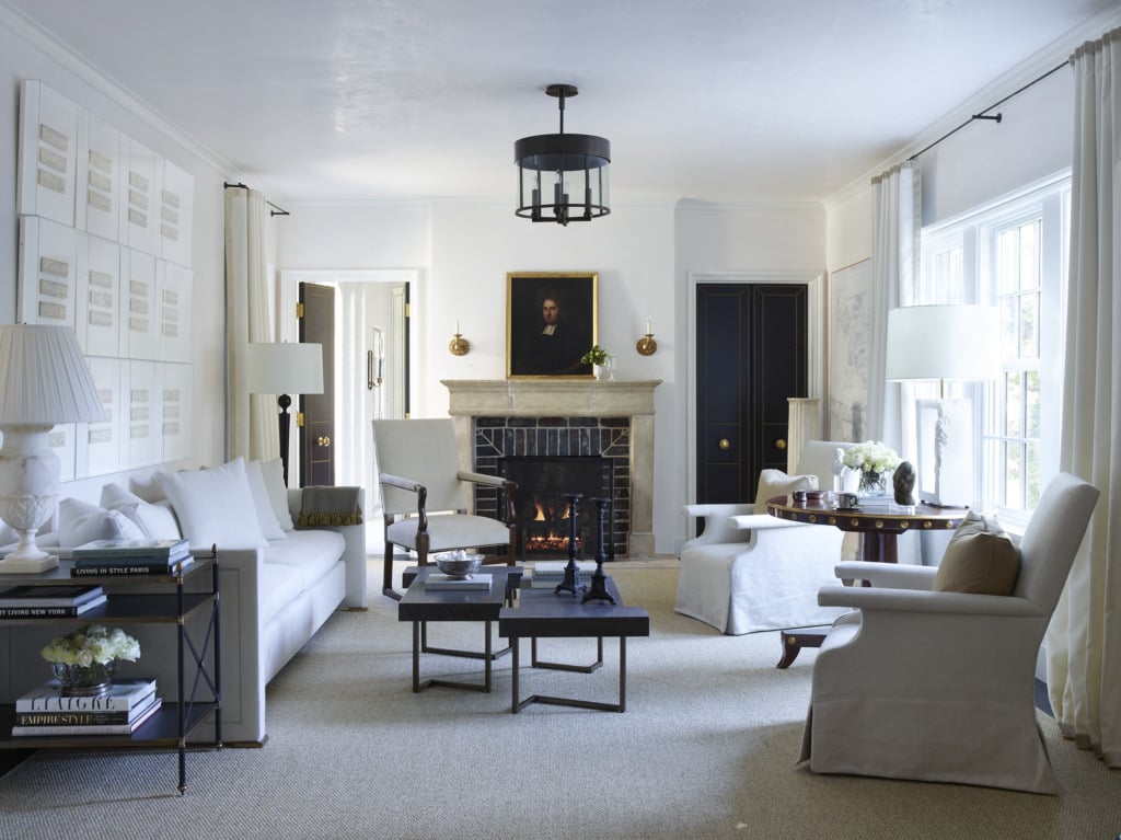 formal living room with french fireplace and slipcovered furniture