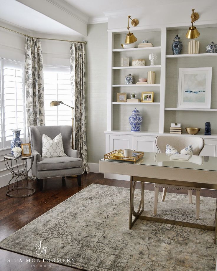 stylish home office with built-ins with wallpaper and gold accents