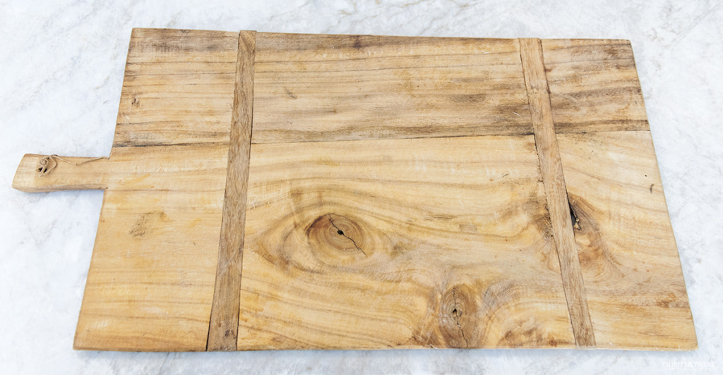 Antique Hungarian bread board on granite kitchen counter