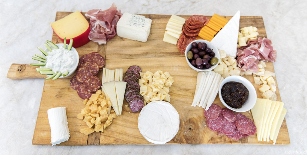 DIY charcuterie board with dips meats and cheeses