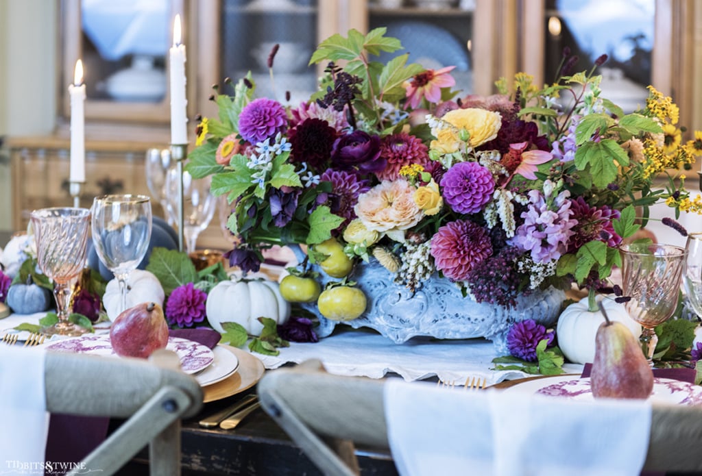 oversized french flower centerpiece on fall table with candles and pumpkins