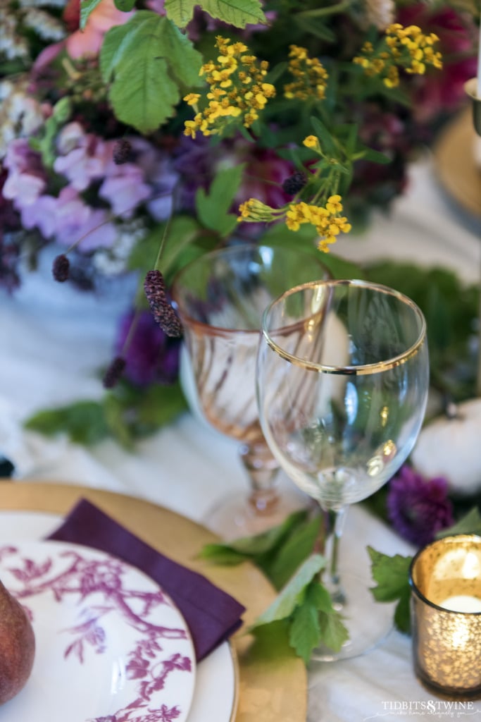 gold rimmed wine glass for purple and pink fall table setting