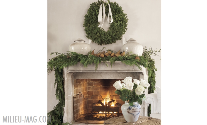 French stone mantel with cedar garland and pears with wreath over mantel