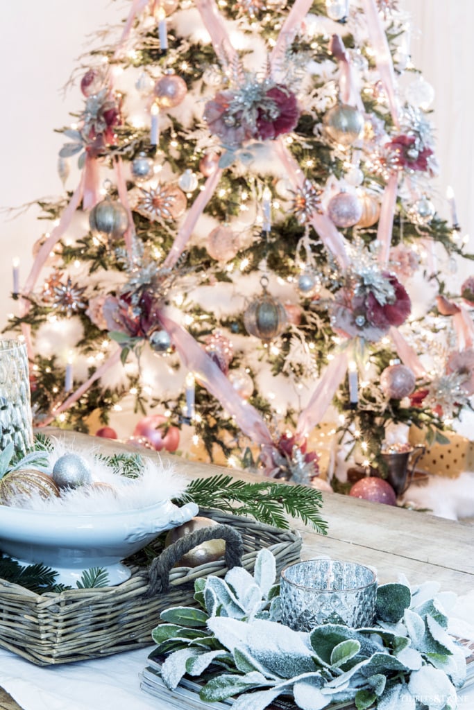 Pink Christmas tree with criss cross ribbons and pink and white coffee table decor