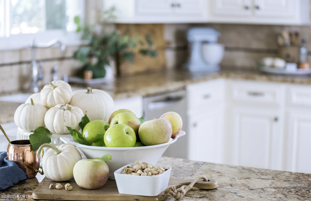 French kitchen decorated for Fall with white pumpkins and eucalyptus